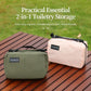 Hanging toiletry bags in army green and pink on a bench