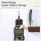 Olive toiletry bag hanging by a hook with front pockets