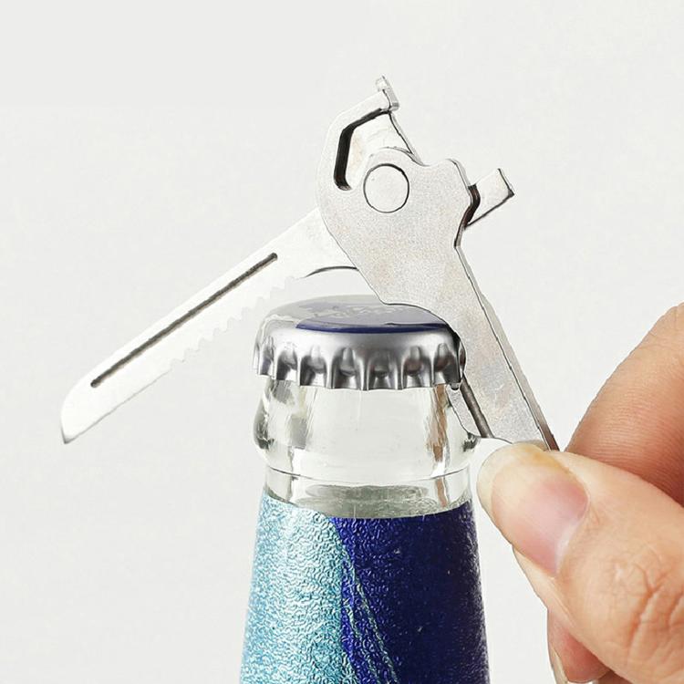 Key-shaped multitool keychain bottle opener lifting a bottle cap