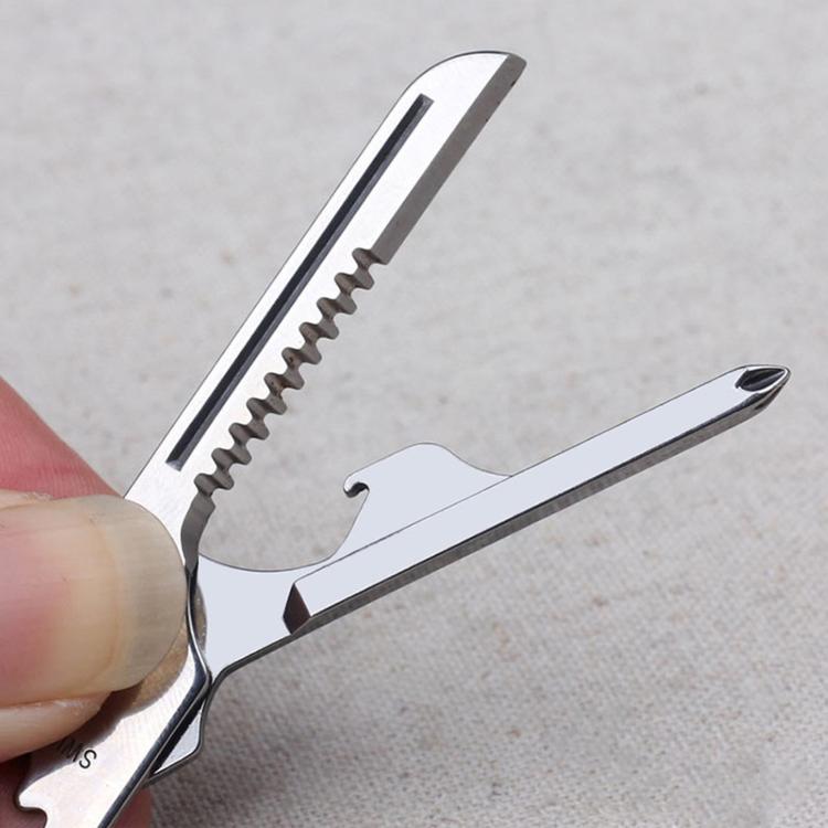 Key-shaped multitool keychain showing serrated saw edge and hooked tool