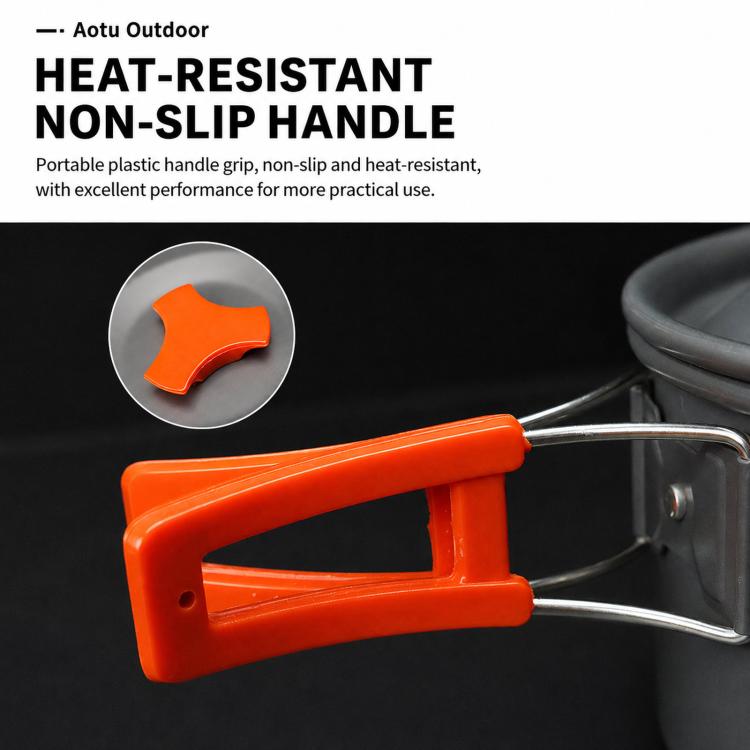 Orange non-slip heat-resistant handle on gray camping kettle