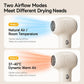 White cordless baby hair dryer showing two airflow mode controls on the handle