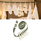 Green portable clip clothesline with six white clips and coiled strap