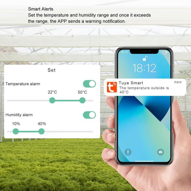 White WiFi smart temperature and humidity meter with smartphone showing alerts