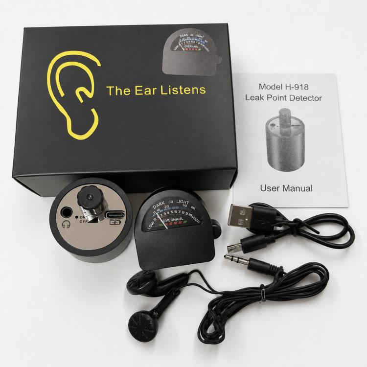 Water leak detector kit with main unit, circular sensor, cables, and user manual