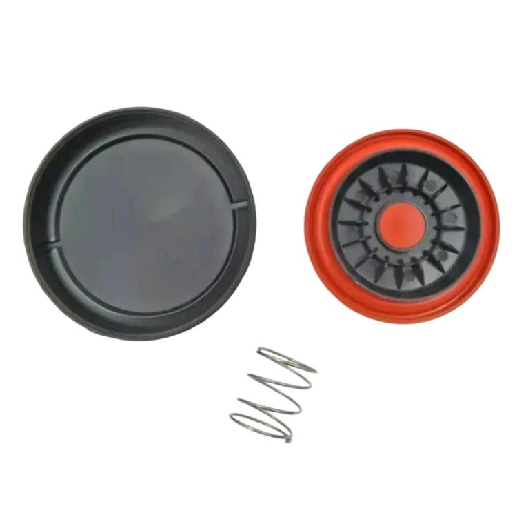 Valve cover cap set with black cover, orange insert, and metal spring