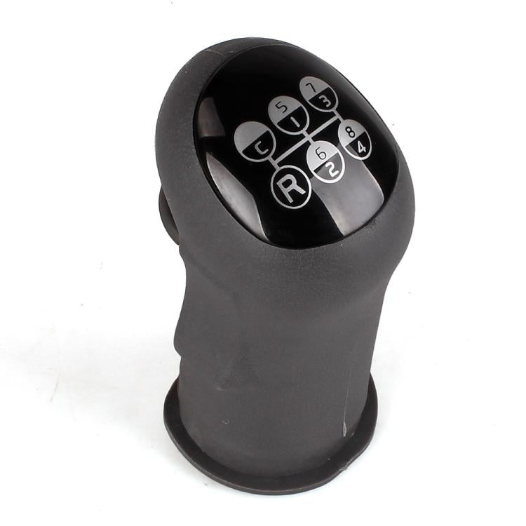 Black gear shift knob with circular shift pattern and lettered/R buttons on top