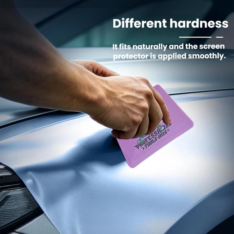 Hand applying purple double-sided wrapping film scraper pad to vehicle wrap