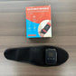Black heated wrist massager band with digital display and control icons