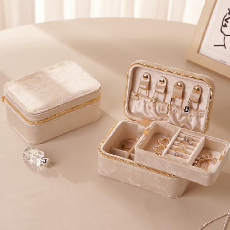 Cream beige velvet travel jewelry box with double zipper, open with earring and ring sections