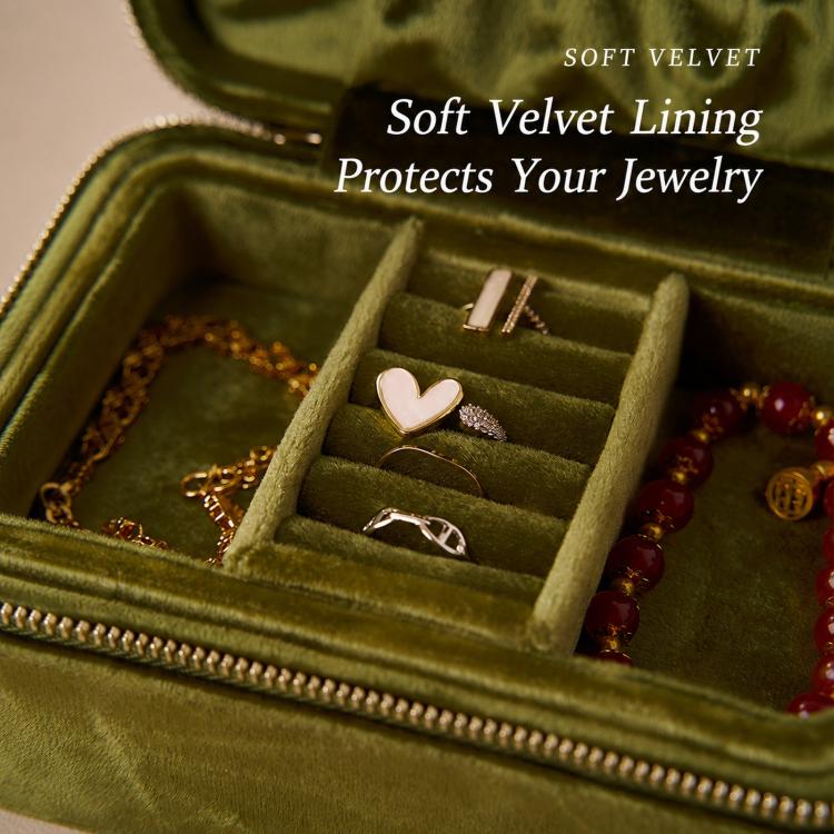 Emerald green velvet jewelry box interior with ring slots and small jewelry compartment dividers