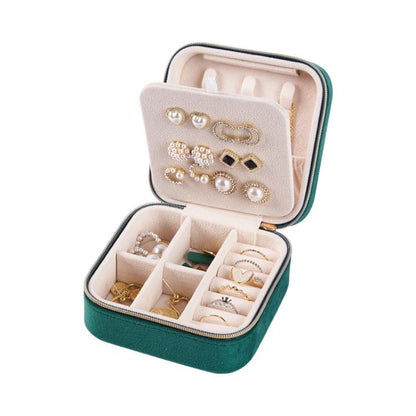 Mini velvet travel jewelry box, open with necklace hooks and stud earring panel