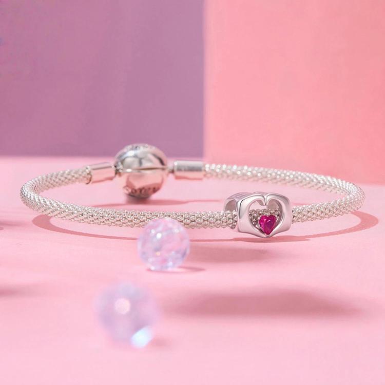 Sterling silver mesh bracelet with pink heart crystal bead charm