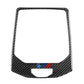 Center control panel sticker with black carbon-fiber pattern and small blue/red emblem