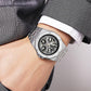 Men's skeleton automatic watch on wrist, silver case with white strap, exposed movement