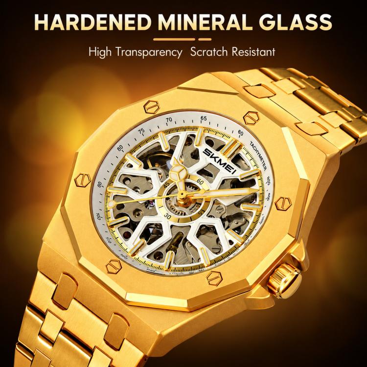Men's skeleton automatic watch close-up, gold case with gold bracelet, exposed dial