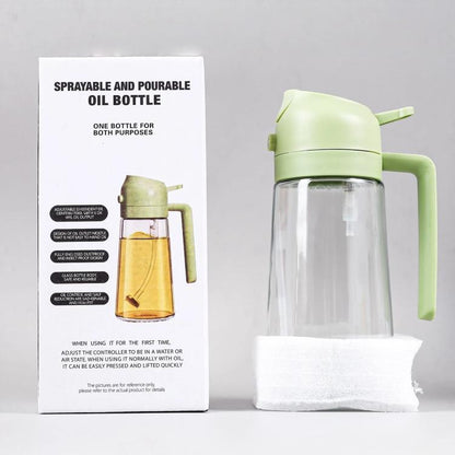 Light green sprayer oil bottle with handle and clear glass body for cooking oil mist