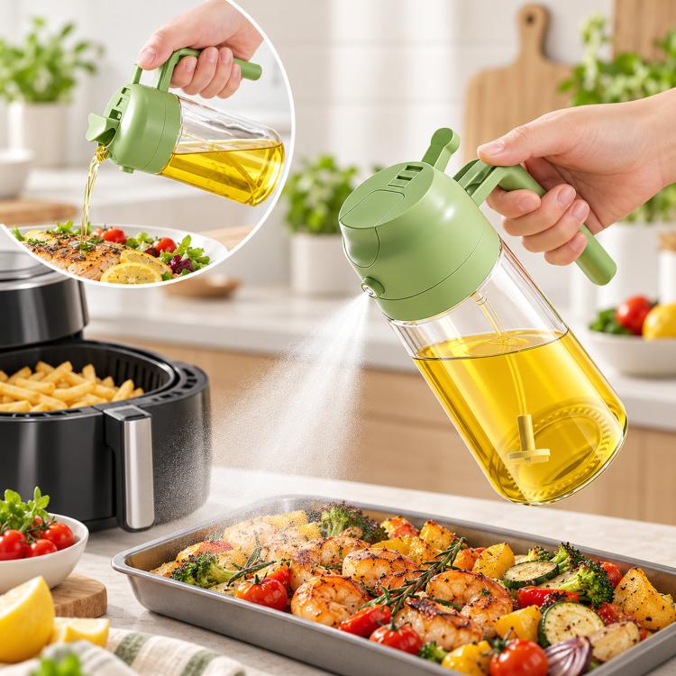 Green glass oil sprayer pouring cooking oil over food from a handle bottle