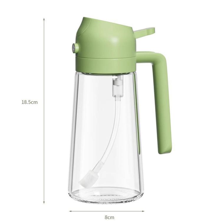 Clear glass oil mister with light green pump, spray head, and side handle