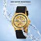 Gold-tone skeleton automatic watch with black leather strap and water droplets