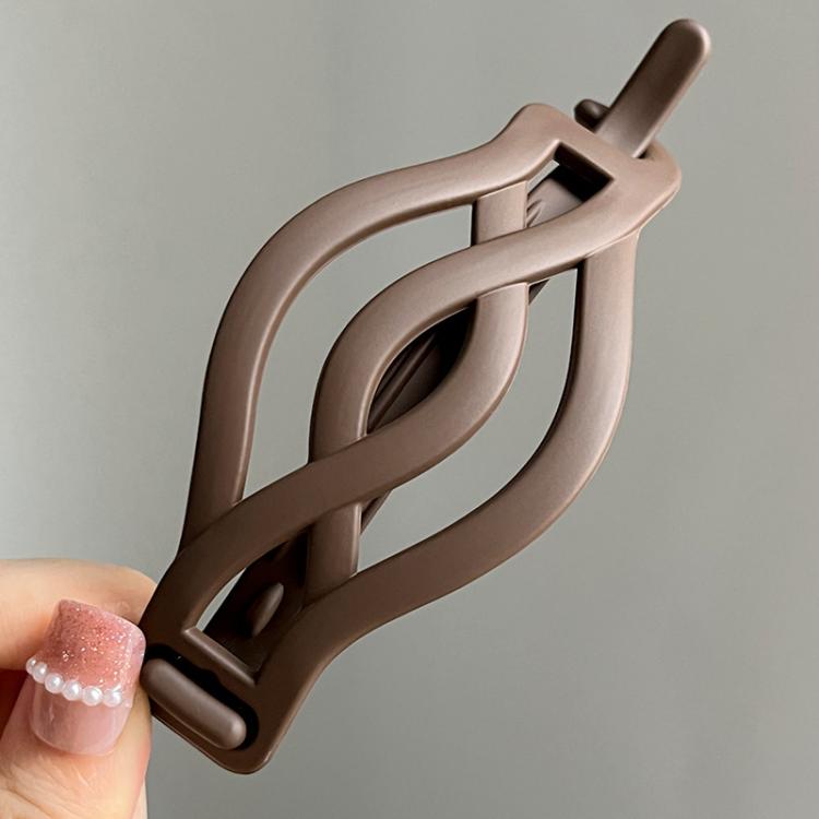 Brown matte curved twist hair clip with curved interlocking barrette design
