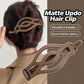 Tan matte curved twist hair clip on an updo hairstyle