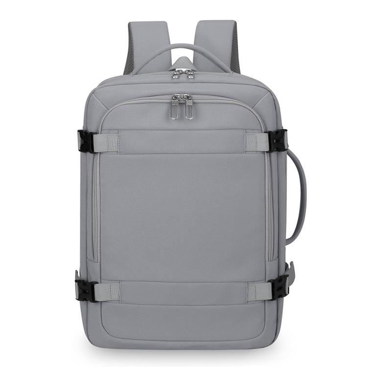 Gray expandable travel backpack with zip front pocket, top handle, and side carry loop.