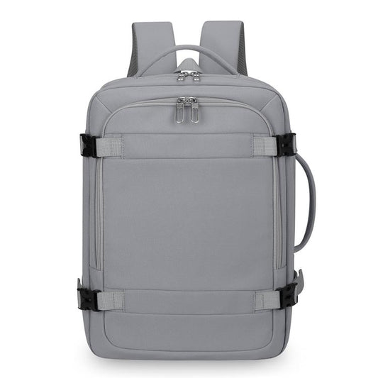 Gray expandable travel backpack with zip front pocket, top handle, and side carry loop.