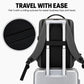 Gray laptop backpack with rear luggage strap for attaching to a rolling suitcase