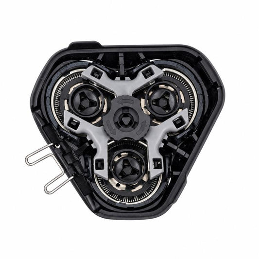 Disassembled triple shaver head assembly with cutter modules and internal gears