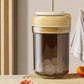 Beige portable ice press cup with lid; clear container shows ice blocks