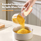 Large rice measuring scoop with sealing clip, beige scoop pouring grains into bowl
