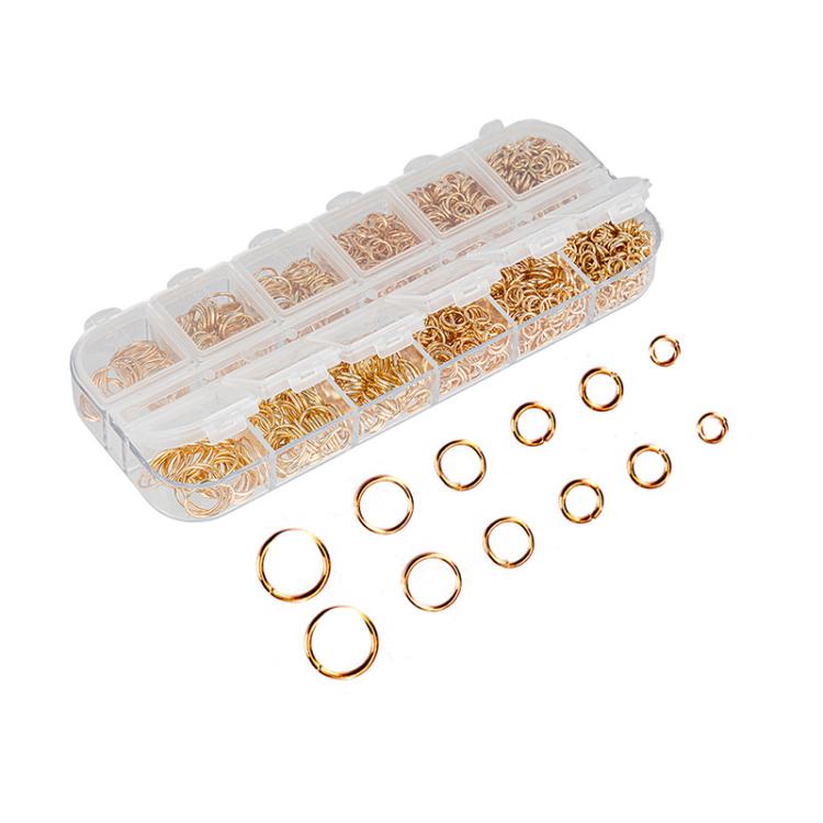 Gold open jump rings in clear organizer case with mixed sizes and individual rings