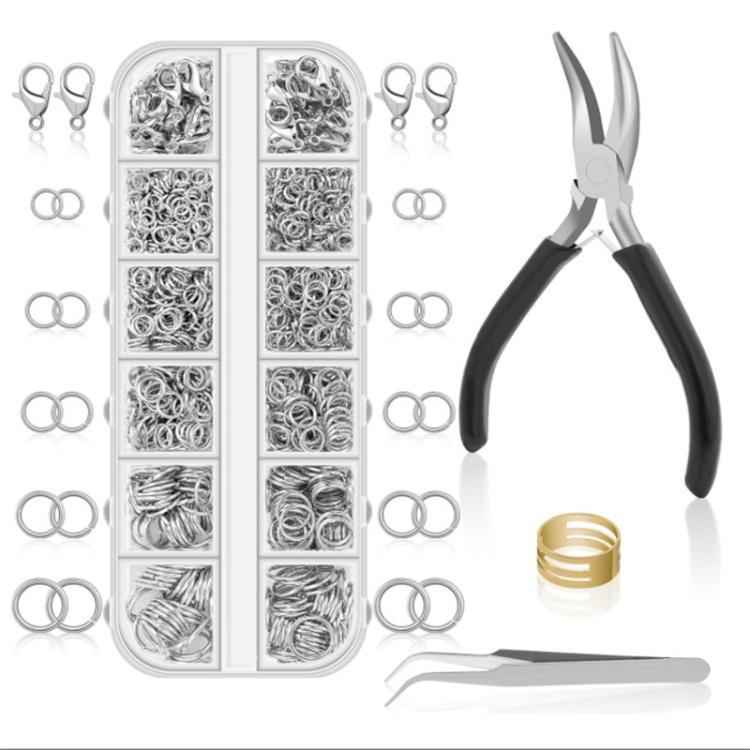 Jewelry making kit organizer with silver jump rings, lobster clasps, and pliers, plus gold rings.