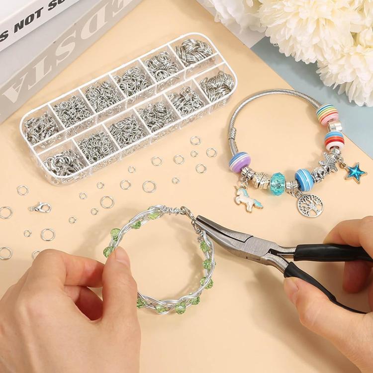 Jewelry making kit for bracelets: jump rings and lobster clasps with pliers in use.