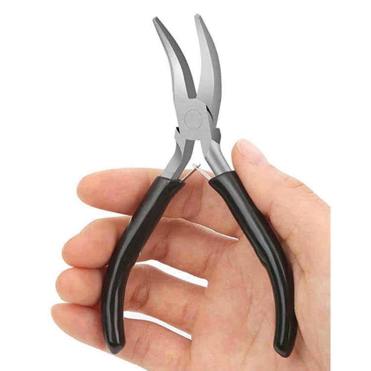 Lobster clasp and jump ring pliers held in hand, black handles and silver tips.