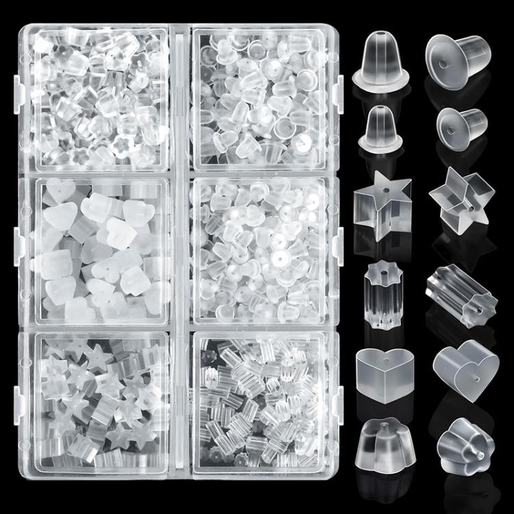 Assorted clear silicone earring backs with star, heart, and disc shapes