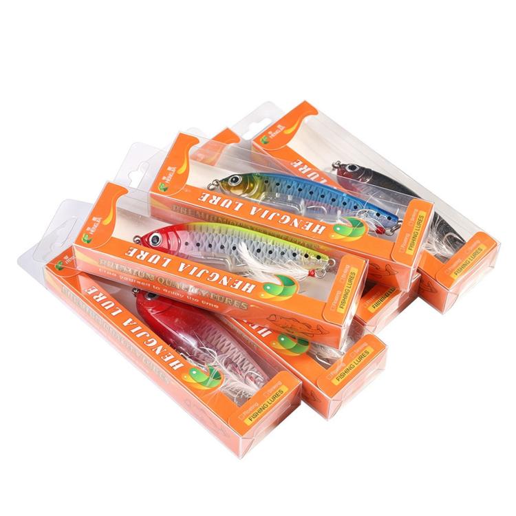 Pack of hard artificial fishing lures in clear boxes with orange packaging