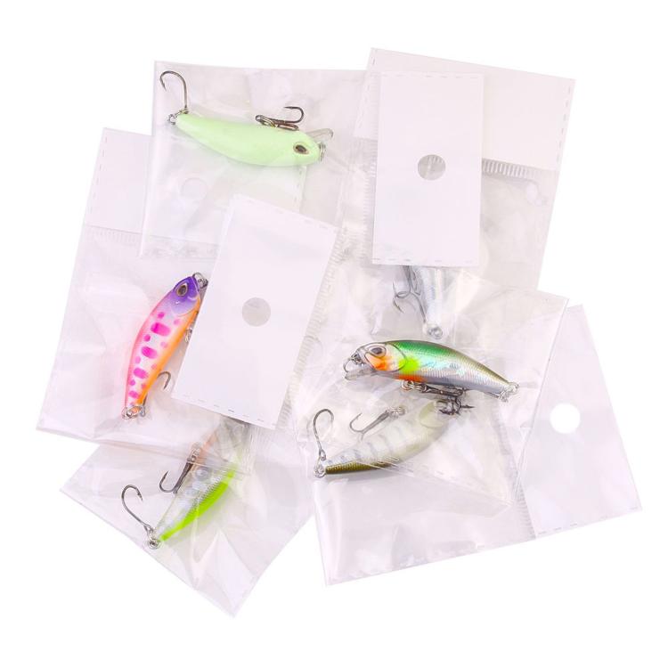 Assorted micro sinking minnow lures in clear bags with treble hooks