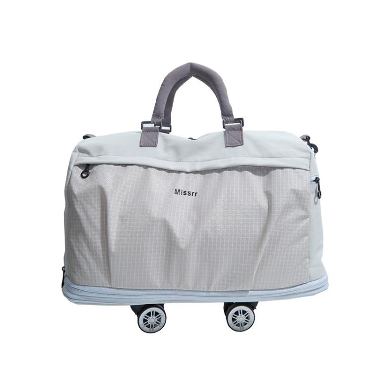 Light grey nylon rolling duffel bag with detachable wheels and padded top handles