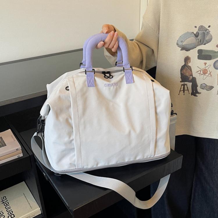 Expandable travel duffel bag in light cream with lavender handles and side straps