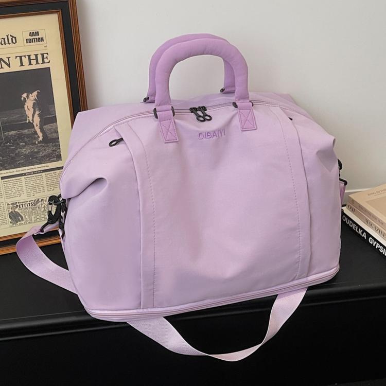 Expandable travel duffel bag in lavender with matching padded handles and side pocket