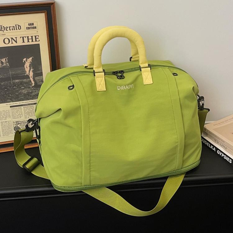 Expandable travel duffel bag in lime green with pale yellow handles and adjustable strap