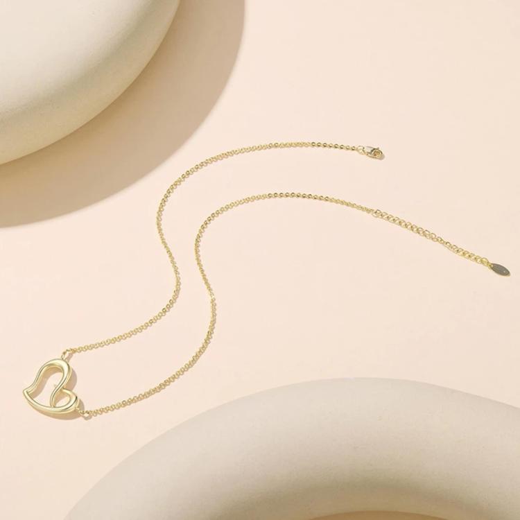 Gold-tone heart pendant necklace with infinity double-heart design