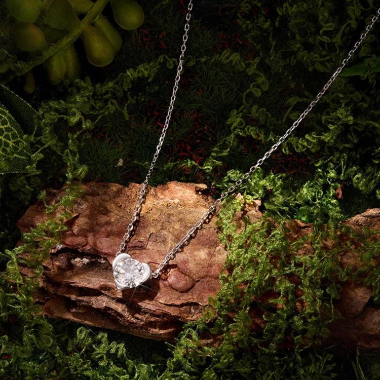Heart-shaped moissanite pendant on a sterling silver chain necklace