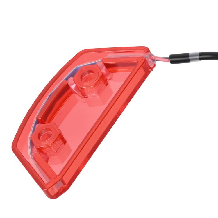 Red taillight light housing with internal mounting brackets and cable lead