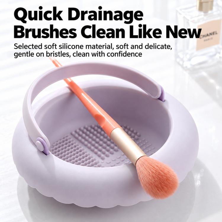 Purple silicone brush cleaning bowl with textured drain mat and makeup brush