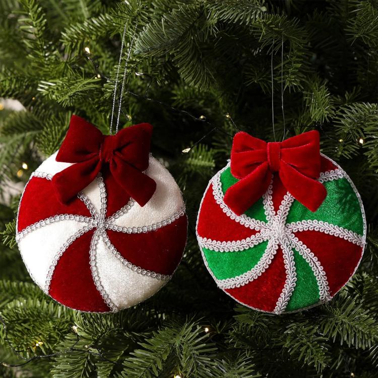 Set of two plush hanging Christmas ornaments: red/white and red/green with bows