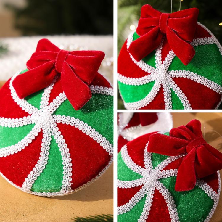 Plush hanging ornament close-up, red and green ball with silver trim and red bow