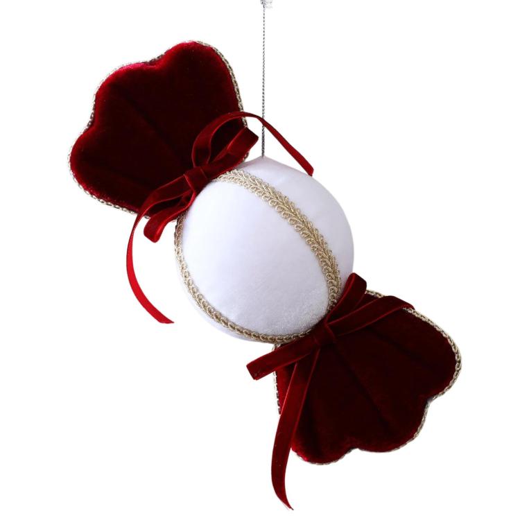 Velvet candy ornament with red scalloped ends, white center, gold trim and red ribbon loop